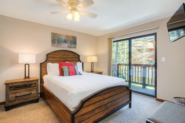 a bedroom with a bed and a tv