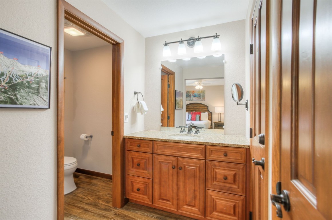 350 4 O Clock Road, Unit C Breckenridge, CO 80424 - Photo 12 of 29 a en suite bathroom with a granite countertop sink and a mirror