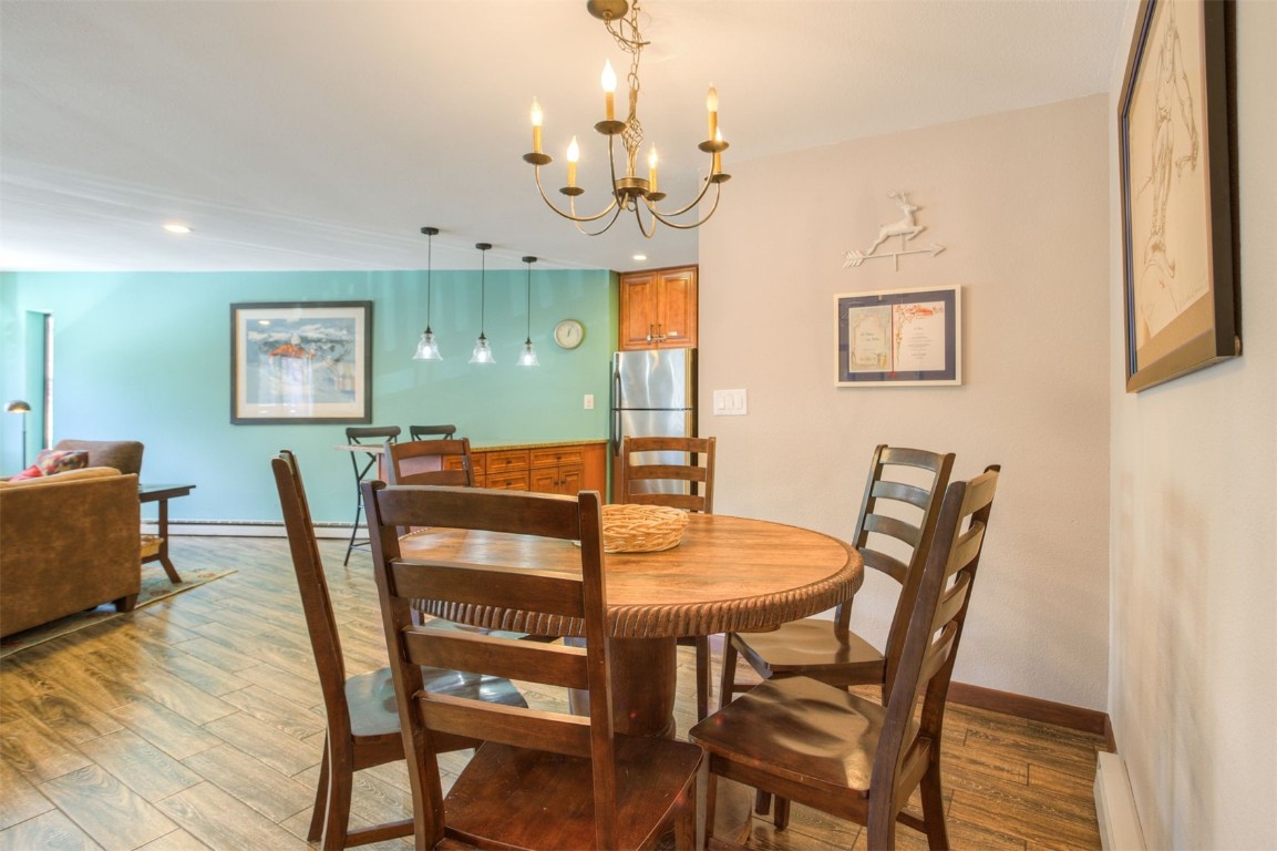 350 4 O Clock Road, Unit C Breckenridge, CO 80424 - Photo 18 of 29 a view of a dining room with furniture and wooden floor