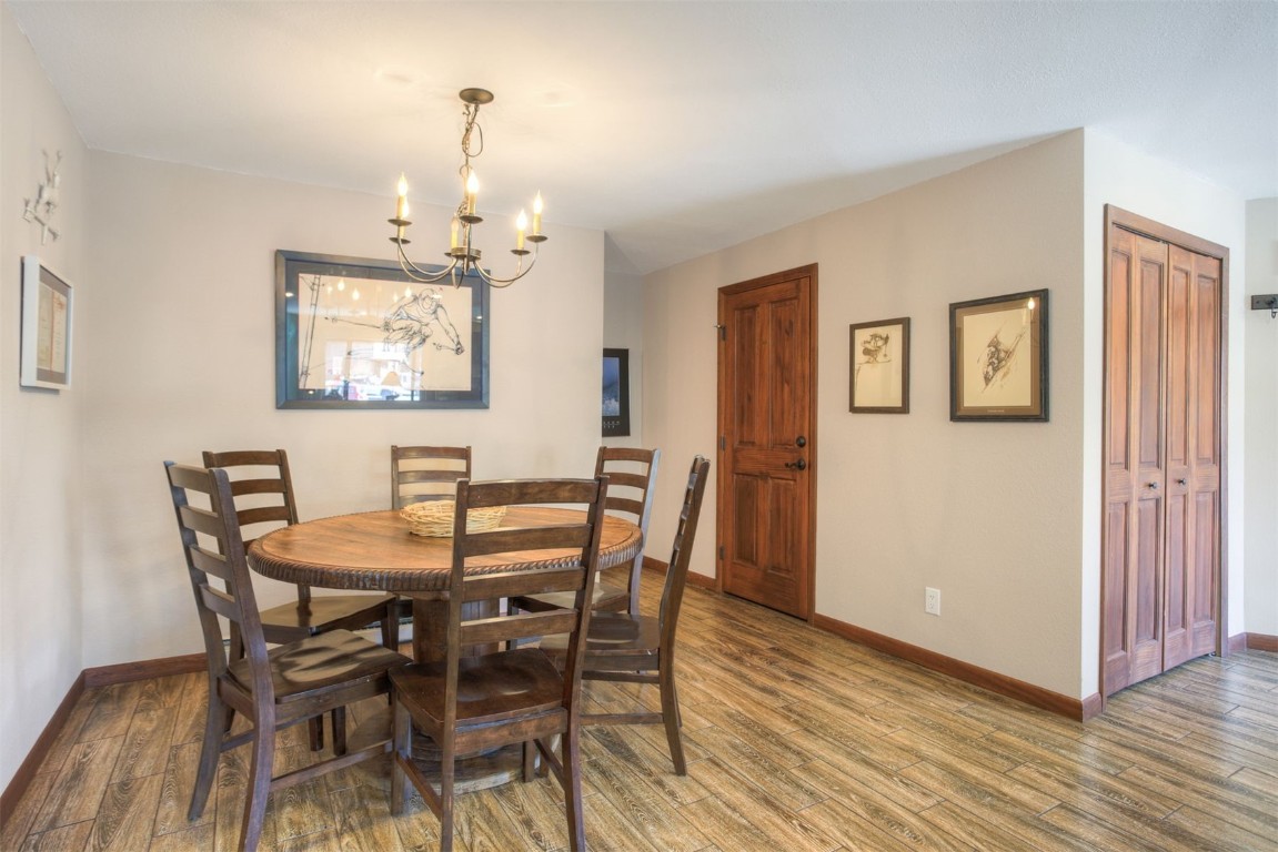 350 4 O Clock Road, Unit C Breckenridge, CO 80424 - Photo 6 of 29 a view of a dining room with furniture and wooden floor