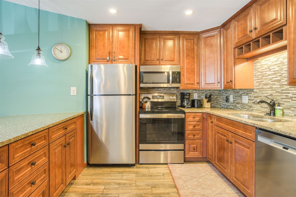 350 4 O Clock Road, Unit C Breckenridge, CO 80424 - Photo 8 of 29 a kitchen with a refrigerator and a sink