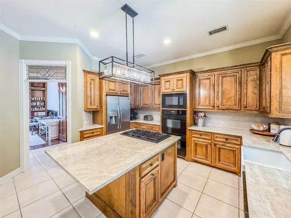 a kitchen with a stove a sink and a microwave