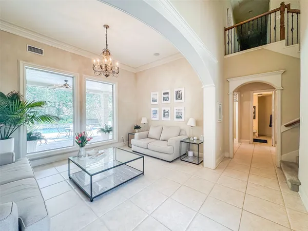 a large kitchen with stainless steel appliances granite countertop a sink refrigerator and cabinets