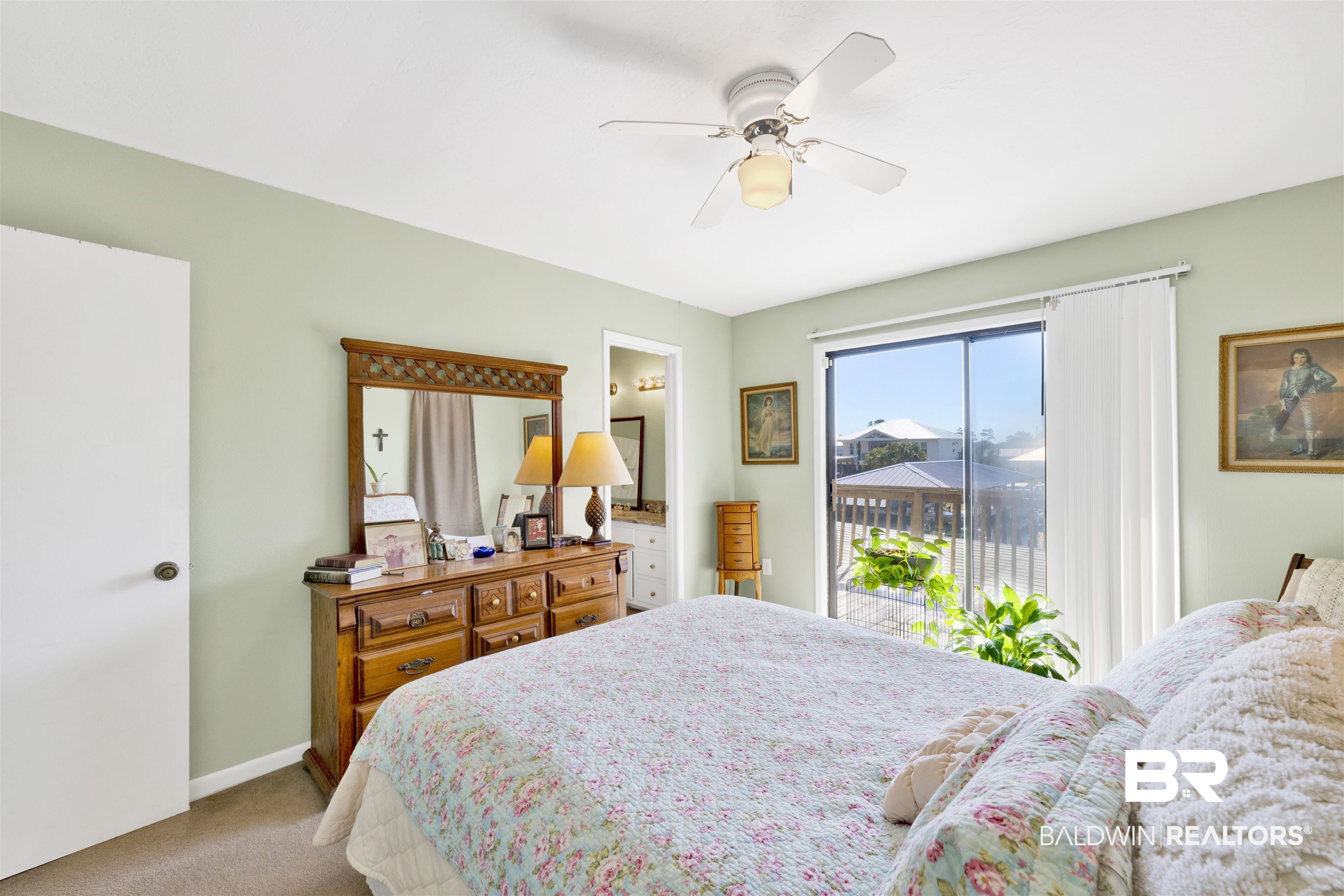 26222 Marina Road Orange Beach, AL 36561 - Photo 22 of 38 Bedroom with access to exterior, carpet flooring, and ceiling fan