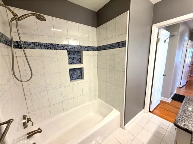 a bathroom with a shower and a tub