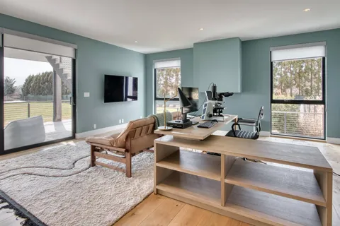 a bed room with a bed and a window