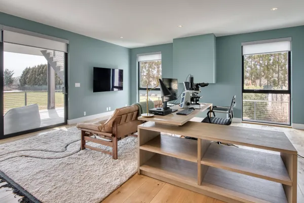 a bed room with a bed and a window