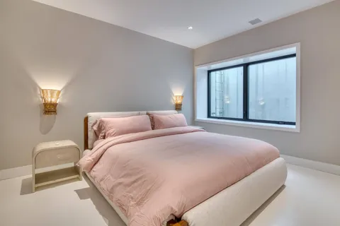 a bathroom with a shower and a glass door