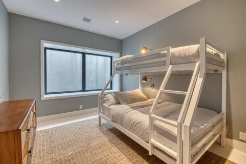 a bedroom with furniture and a flat screen tv