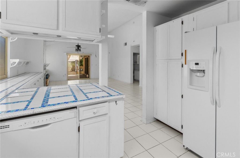 29368 Murrieta Road Menifee, CA 92586 - Photo 9 of 20 a view of a kitchen with white cabinets
