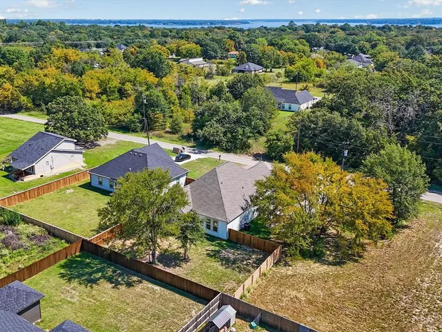 an aerial view of a house with a garden