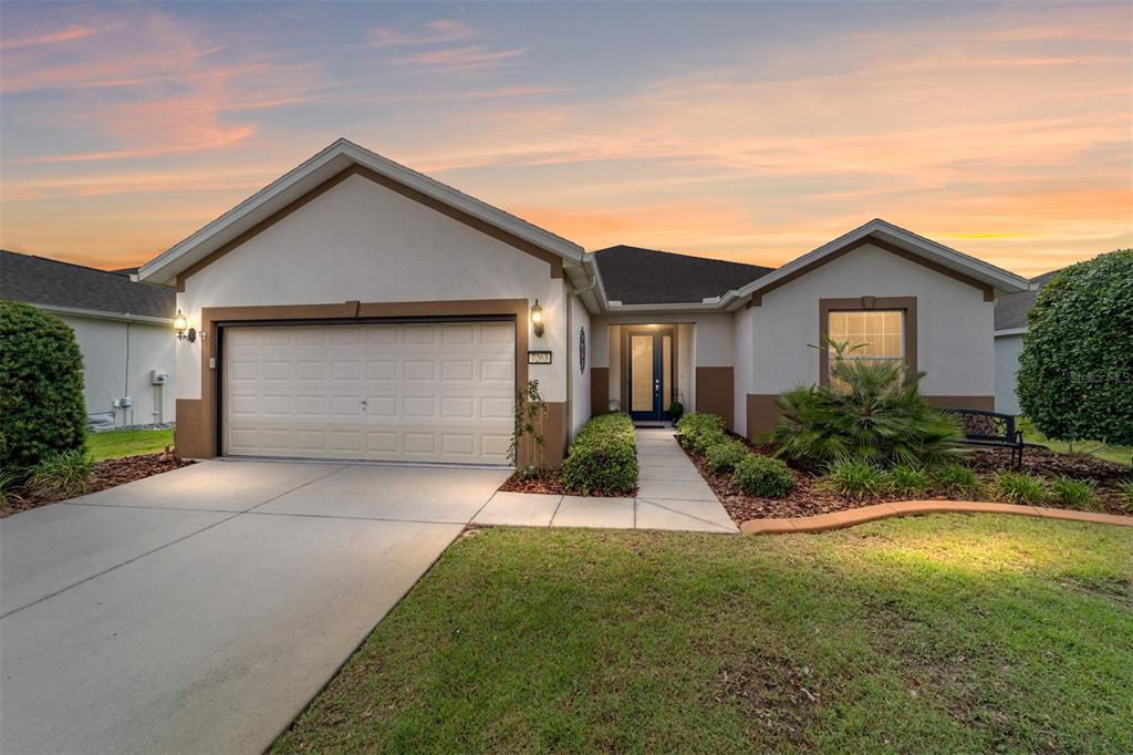 a front view of a house with a yard