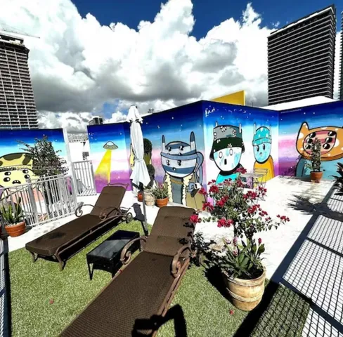 a view of a chairs and table in backyard