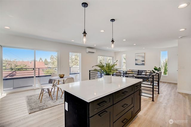 a kitchen with a table and chairs in it