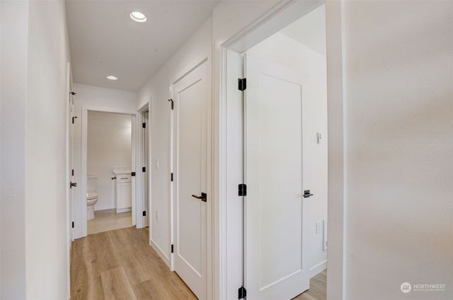 a view of a bathroom with a shower and a sink