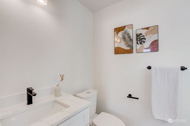 a bathroom with a toilet and a sink