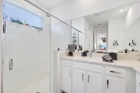 an aerial view of a house with a big yard