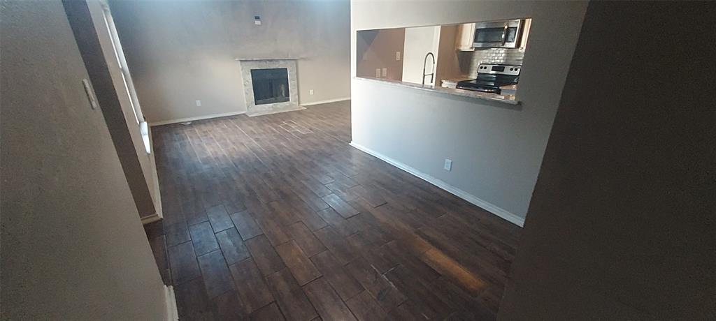 7340 Skillman Street, Unit 512 Dallas, TX 75231 - Photo 4 of 15 wooden floor in an empty room