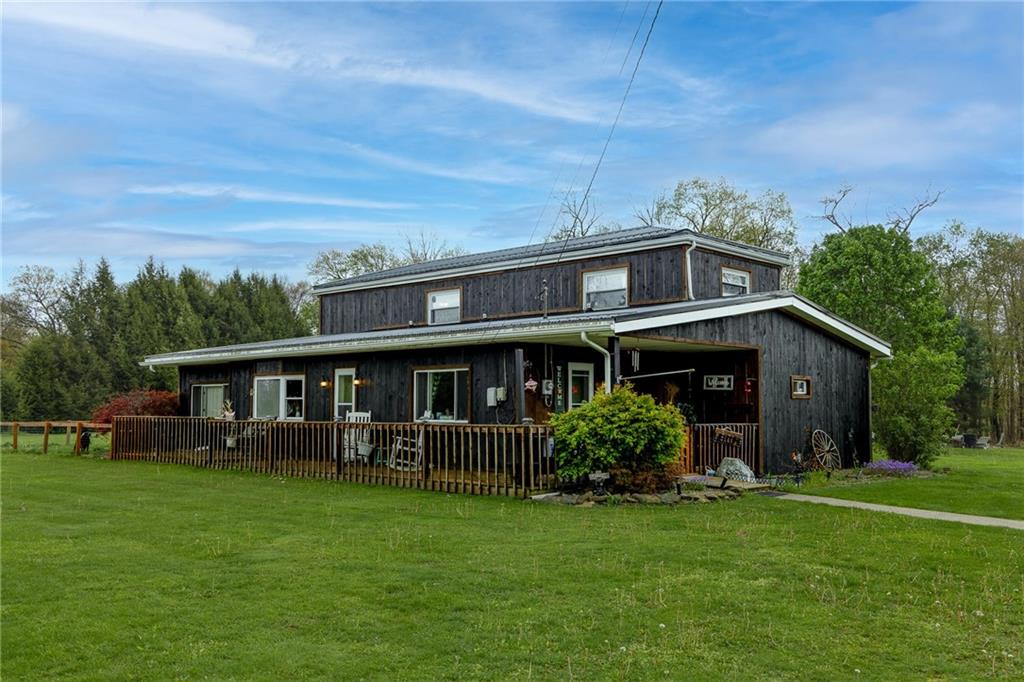 118 Eau Claire Road Boyers, PA 16020 - Photo 1 of 24 a view of a house with a garden