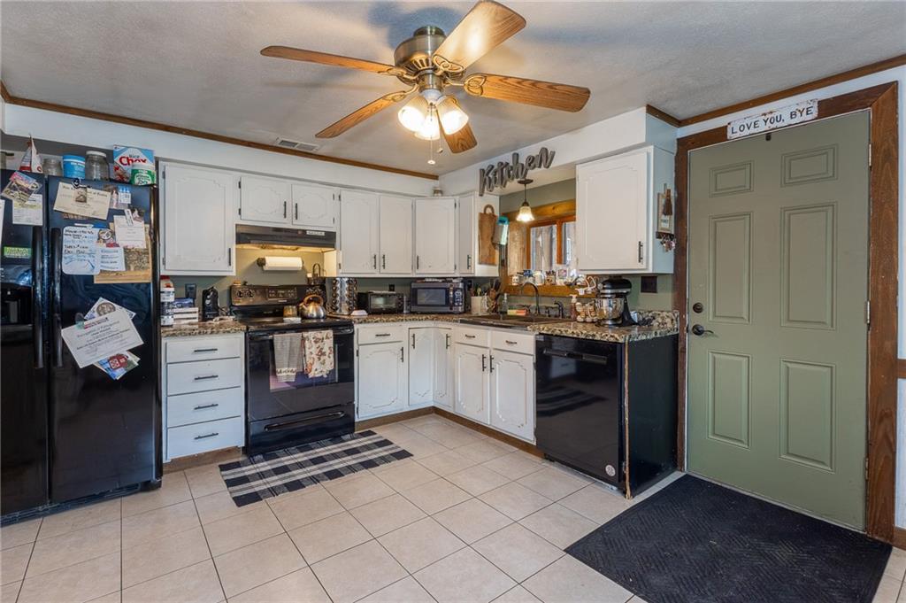 118 Eau Claire Road Boyers, PA 16020 - Photo 15 of 24 a kitchen with stainless steel appliances a refrigerator sink and microwave