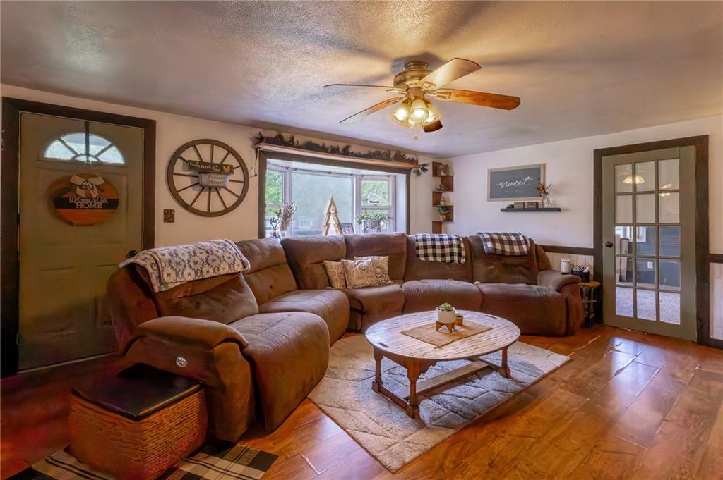 118 Eau Claire Road Boyers, PA 16020 - Photo 17 of 24 a living room with furniture and wooden floor