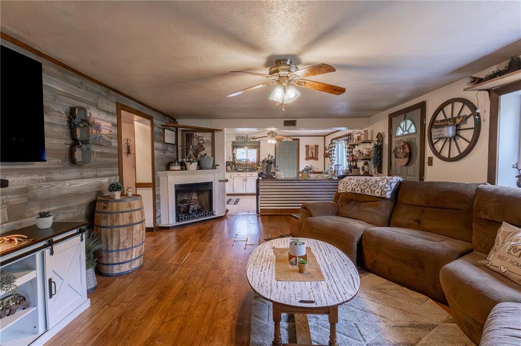 118 Eau Claire Road Boyers, PA 16020 - Photo 18 of 24 a living room with furniture and a fireplace