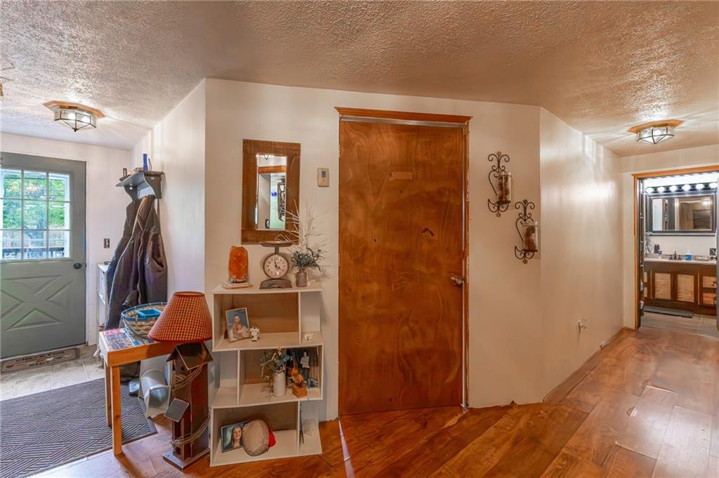 118 Eau Claire Road Boyers, PA 16020 - Photo 21 of 24 a view of a bedroom with wooden floor and furniture