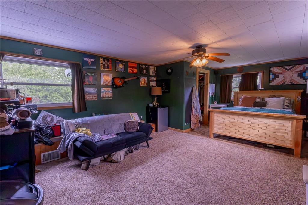 118 Eau Claire Road Boyers, PA 16020 - Photo 23 of 24 a bedroom with furniture and a fan