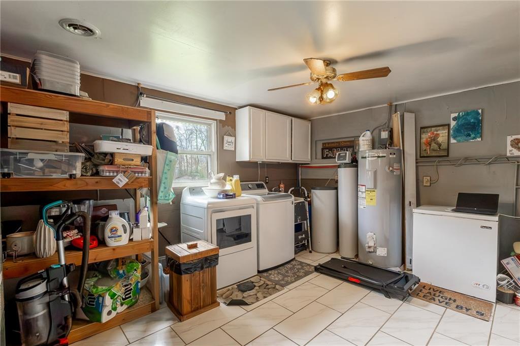 118 Eau Claire Road Boyers, PA 16020 - Photo 24 of 24 a kitchen with refrigerator and cabinets