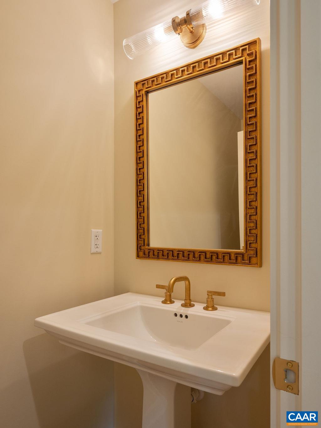 25 Old Farm Road Charlottesville, VA 22903 - Photo 24 of 49 a bathroom with a sink and a mirror