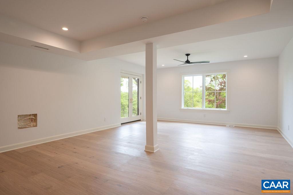 25 Old Farm Road Charlottesville, VA 22903 - Photo 36 of 49 an empty room with wooden floor and windows