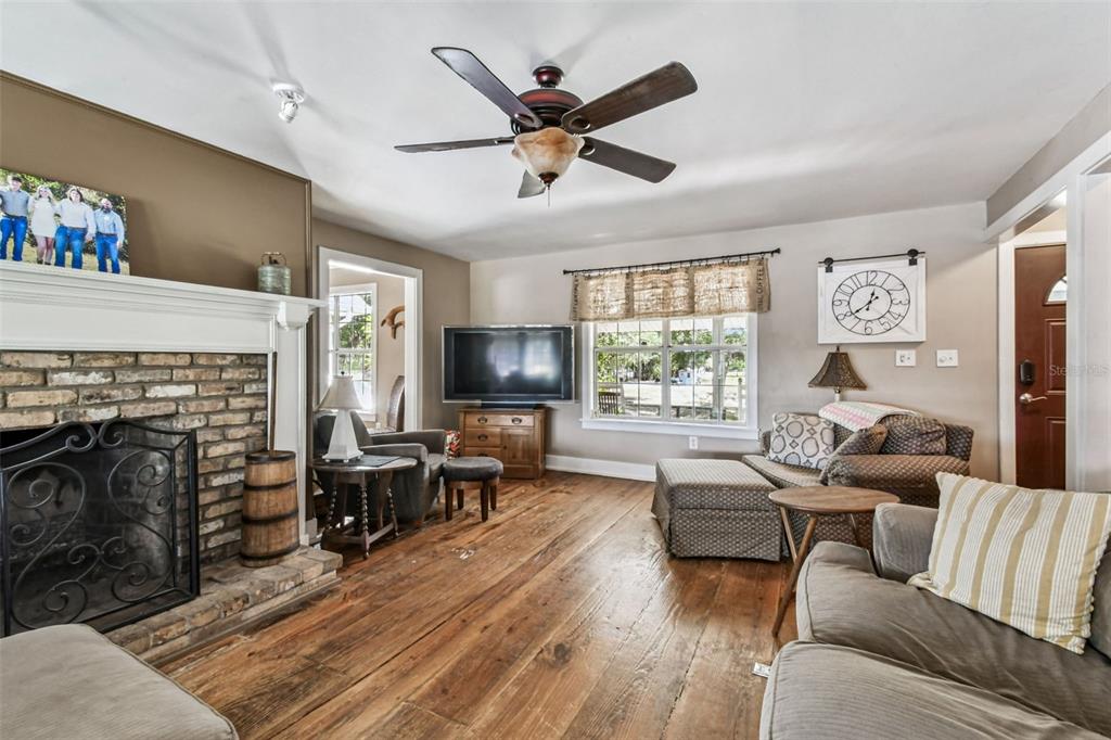 15019 Carlton Lake Road Wimauma, FL 33598 - Photo 23 of 89 a living room with furniture fireplace and a window