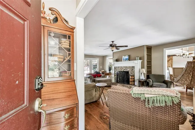a bedroom with furniture and a fireplace