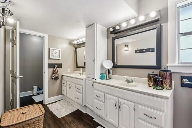 a view of a house with a patio and a yard