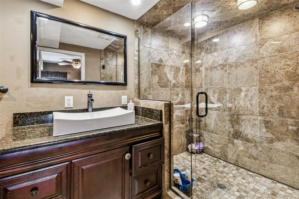 15019 Carlton Lake Road Wimauma, FL 33598 - Photo 41 of 89 a bathroom with a sink a vanity and a mirror
