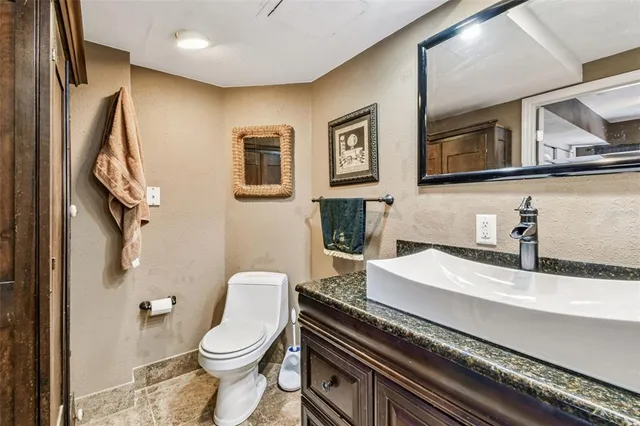 a bedroom with a bed and ceiling fan