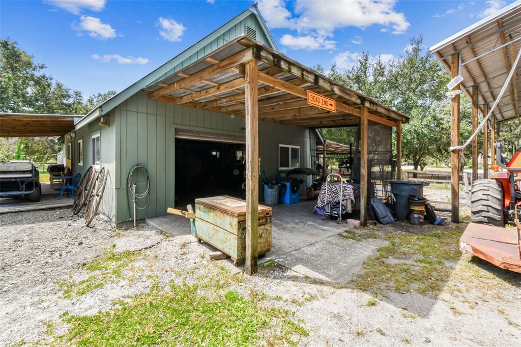 15019 Carlton Lake Road Wimauma, FL 33598 - Photo 48 of 89 a view of a chair and table in backyard of the house