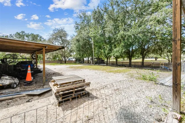 a view of a yard with table and chairs