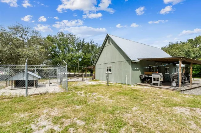 a view of a yard with swimming pool