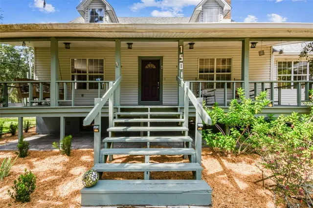 a backyard of a house with lots of green space