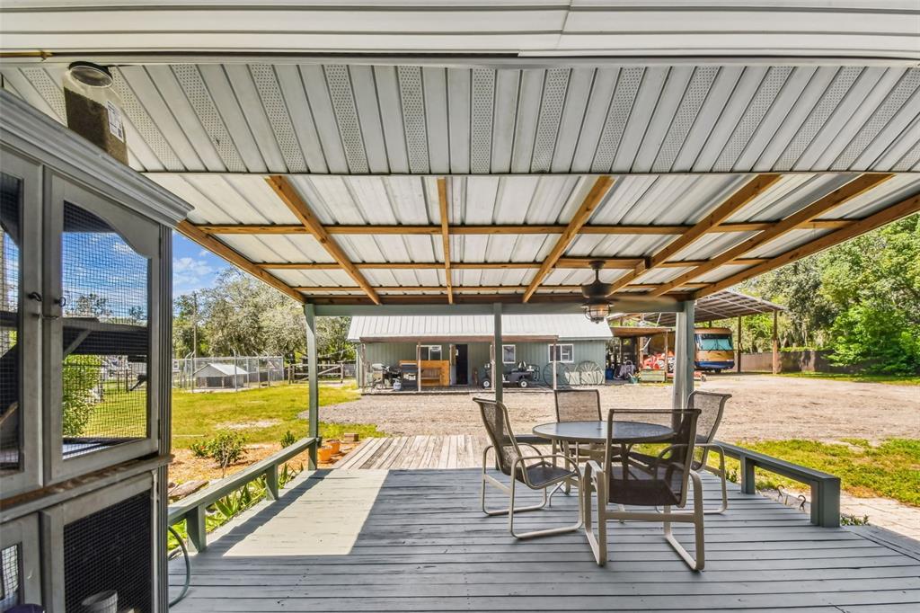 15019 Carlton Lake Road Wimauma, FL 33598 - Photo 65 of 89 a view of a swimming pool with outdoor seating