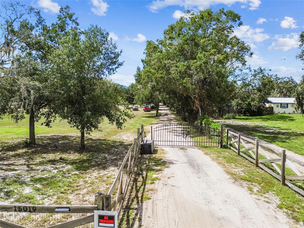 15019 Carlton Lake Road Wimauma, FL 33598 - Photo 87 of 89 a view of a yard with swimming pool