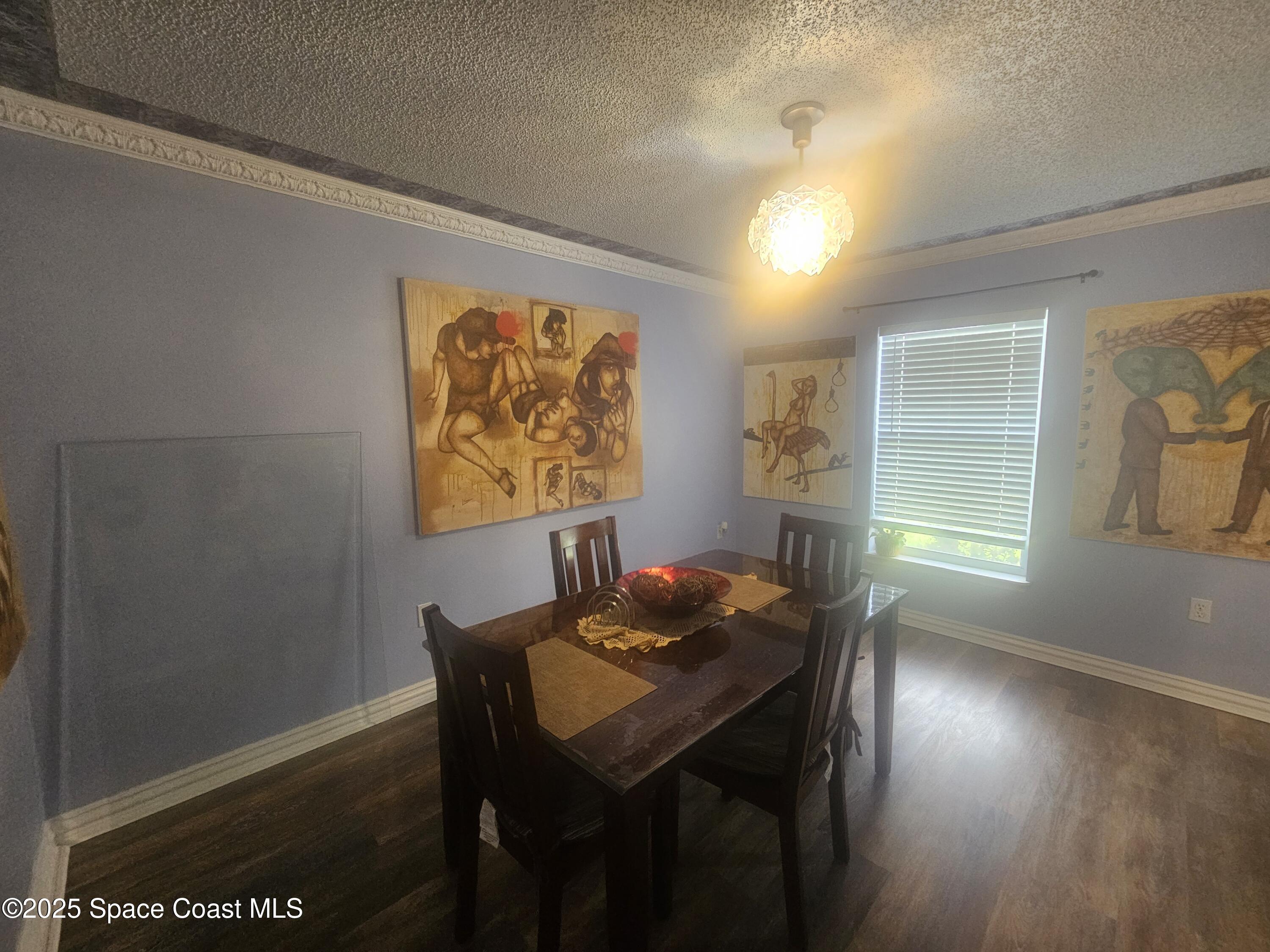 2240 Spring Creek Circle Palm Bay, FL 32905 - Photo 15 of 29 a dining room with furniture and window