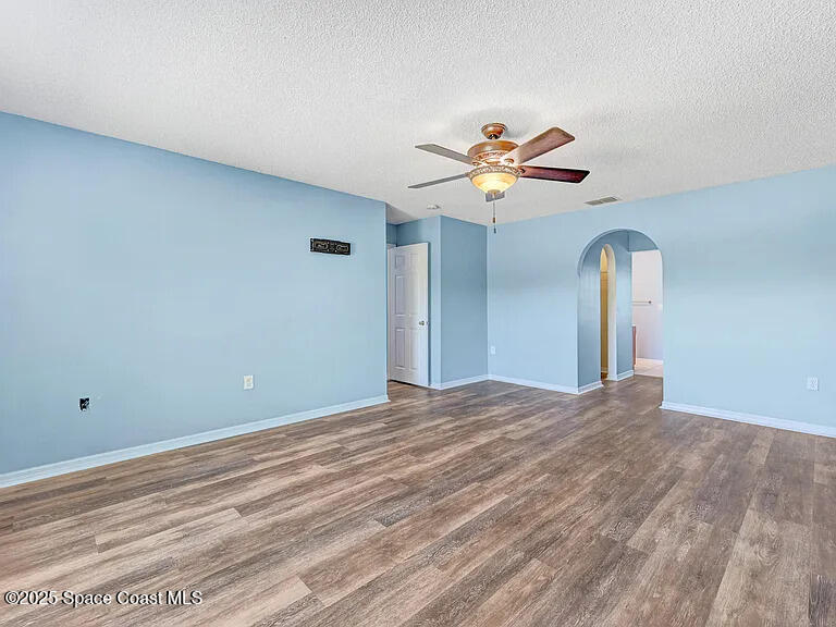 2240 Spring Creek Circle Palm Bay, FL 32905 - Photo 29 of 29 a view of a room with a ceiling fan and window