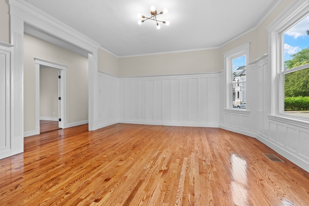 37 George Street, Unit 37 Newton, MA 02458 - Photo 18 of 35 a view of empty room with wooden floor and fan