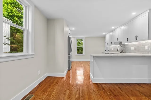 a view of kitchen with wooden floor and electronic window