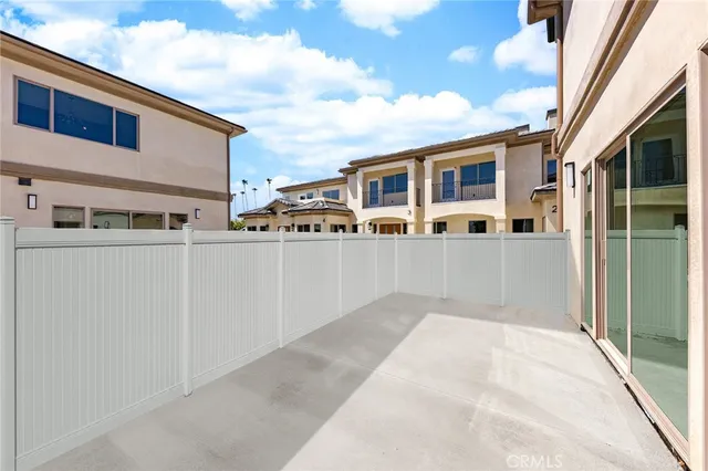 a living room with furniture a rug and a window