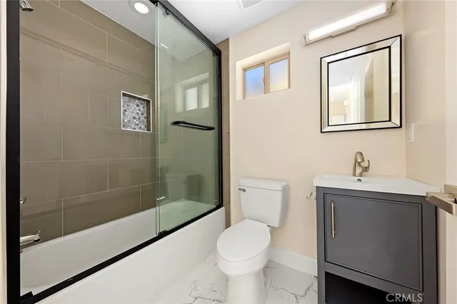 a bedroom with bed and window