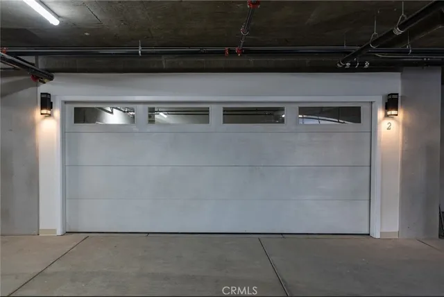 a view of a white house with large windows