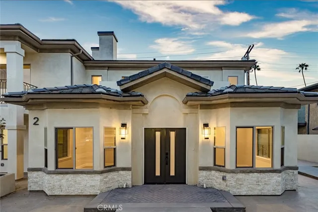 a view of a dry yard with wooden fence